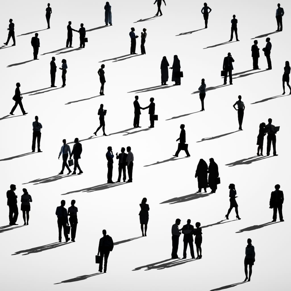Overhead view of people at work — one brain for the whole firm